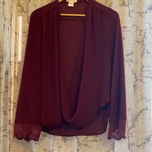 Burgundy Surplice Blouse with lace sleeve detail.